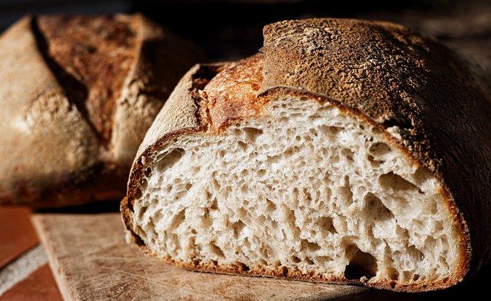A Simple Sourdough Boule Baked in a Clay Baker